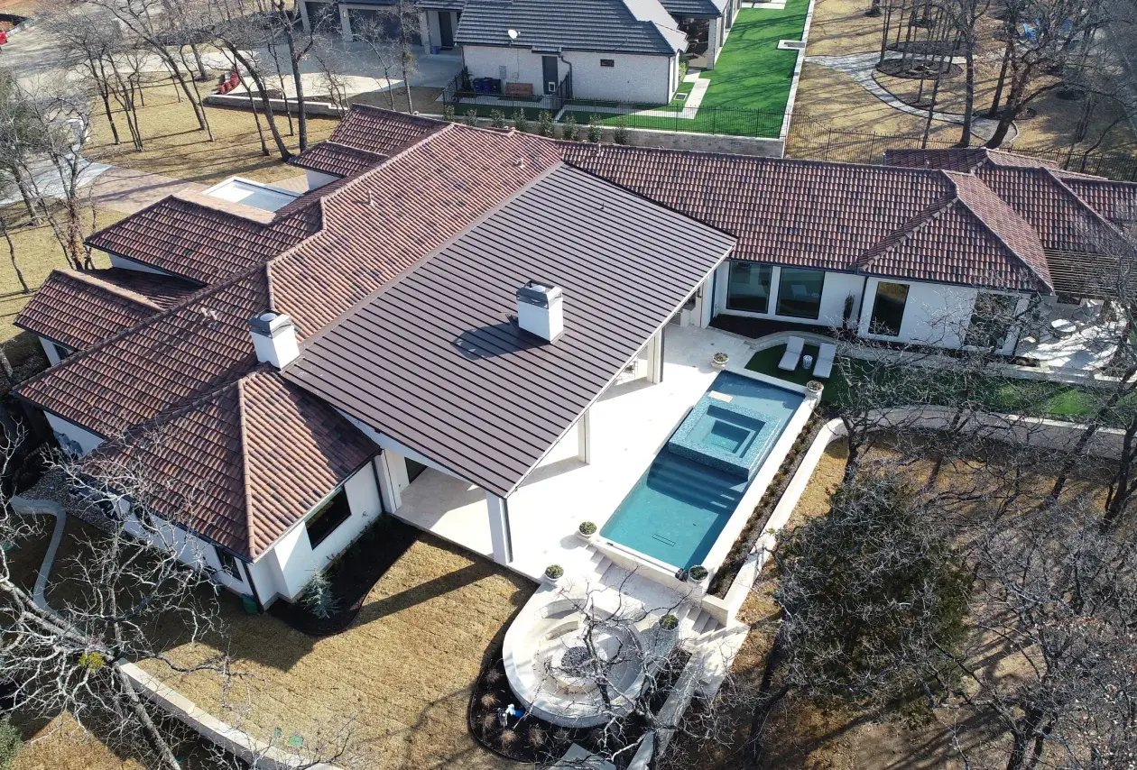 Aerial view of home with backyard pool.