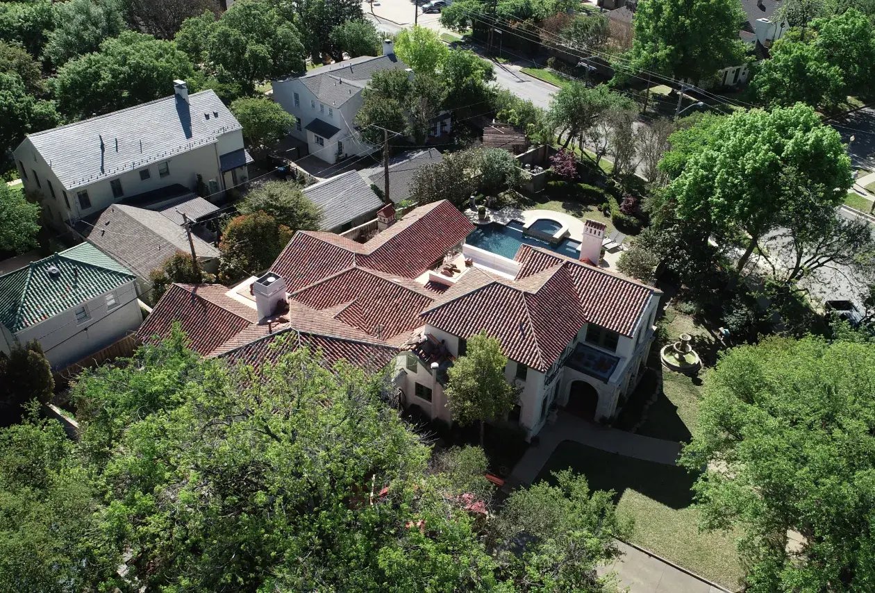 Aerial view of home with tile roof.