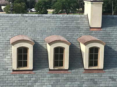 Copper roof dormers on slate roof home