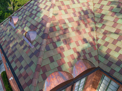 Multi-colored copper shingles with aging patina