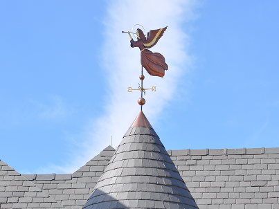 Copper steeple roof with weather vane