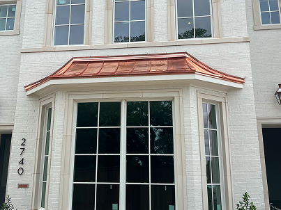 Copper awning above residential entrance